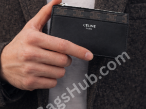 black-premium-inspired-card-holder-wallet-in-male-hand-compact-slim-design-with-zip-pocket-celine-style