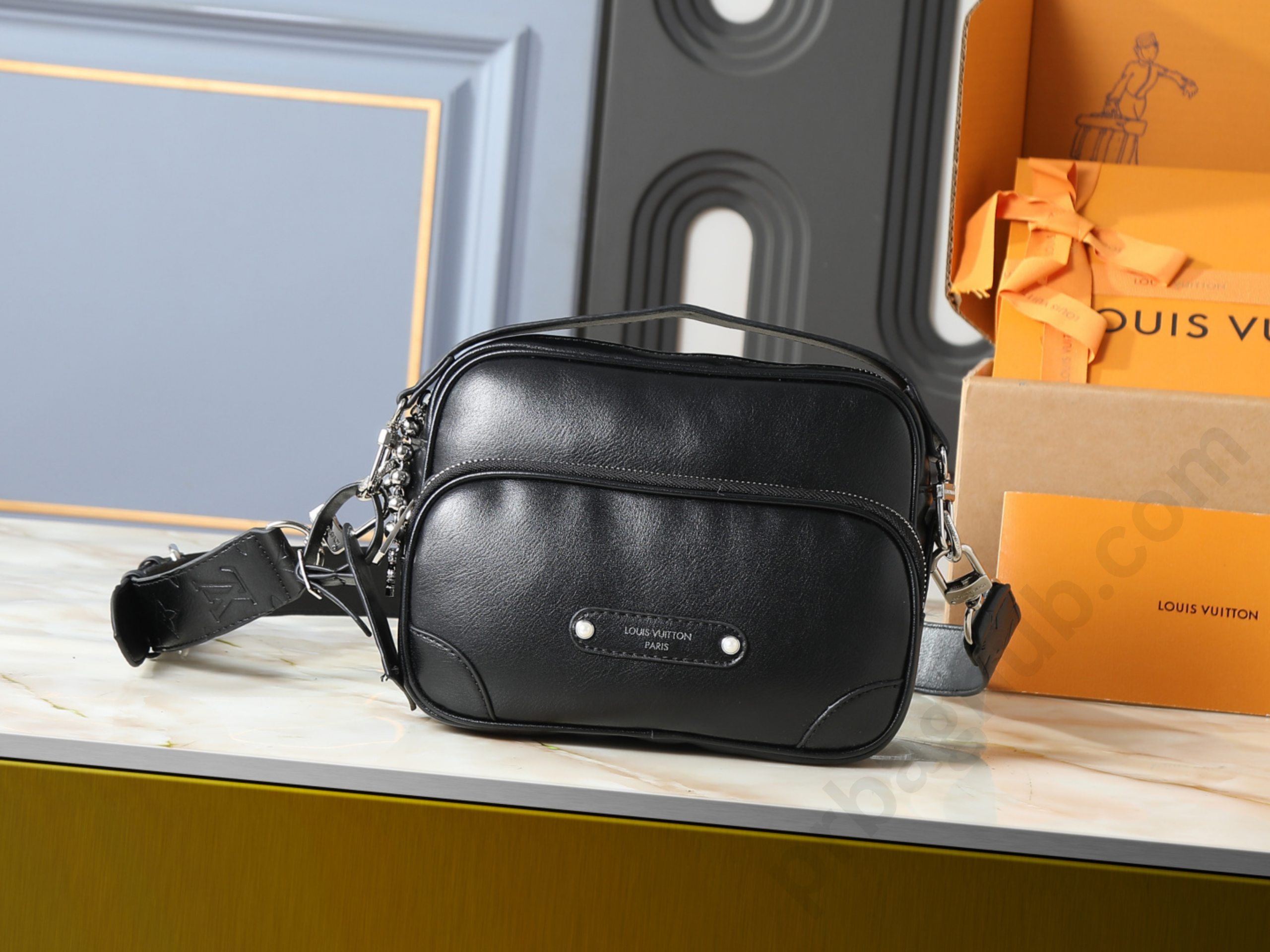 lv-black-leather-mini-camera-crossbody-bag-on-table-with-adjustable-strap-designer-inspired-shoulder-bag