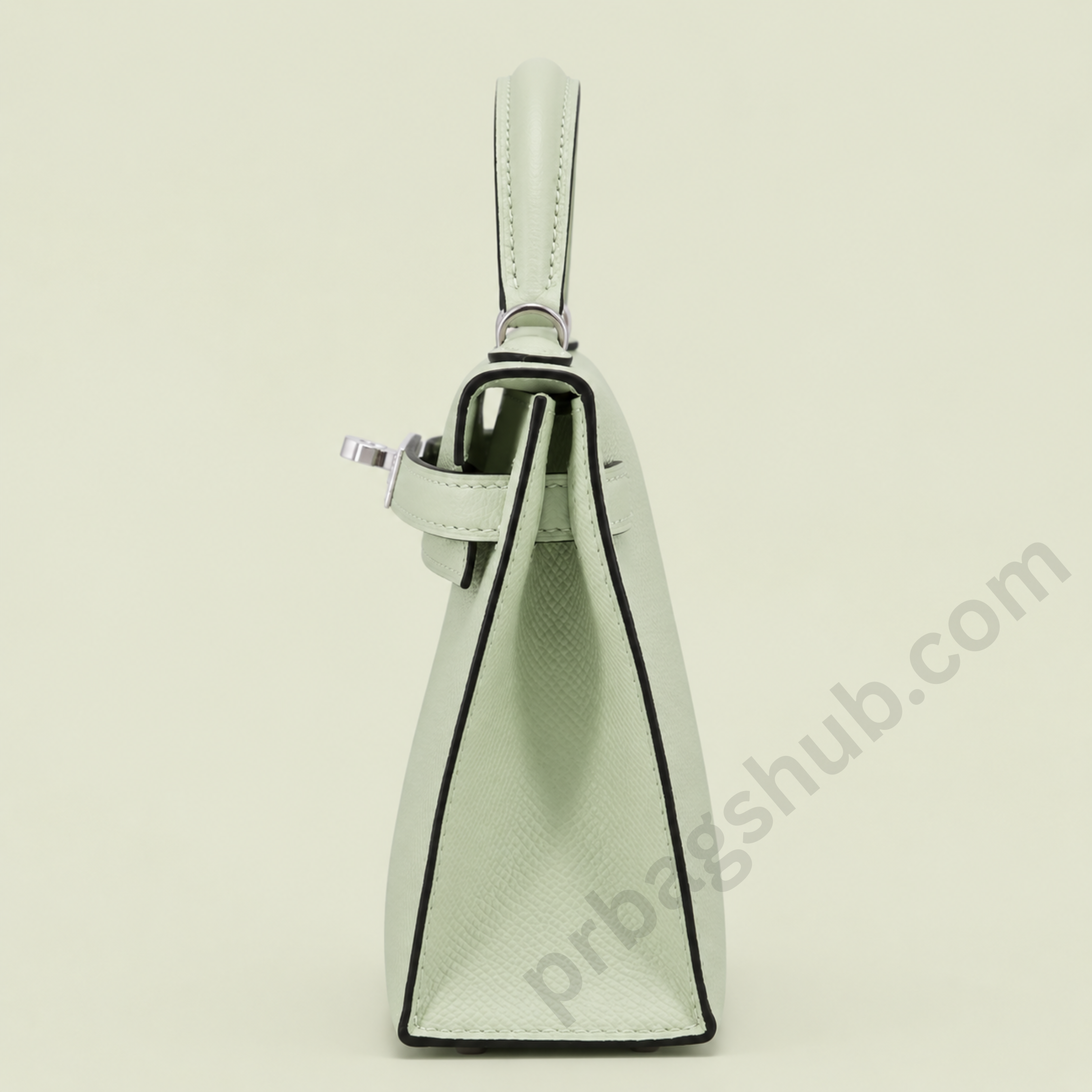 mint-green-kelly-style-top-handle-handbag-side-view-with-silver-hardware-on-light-background