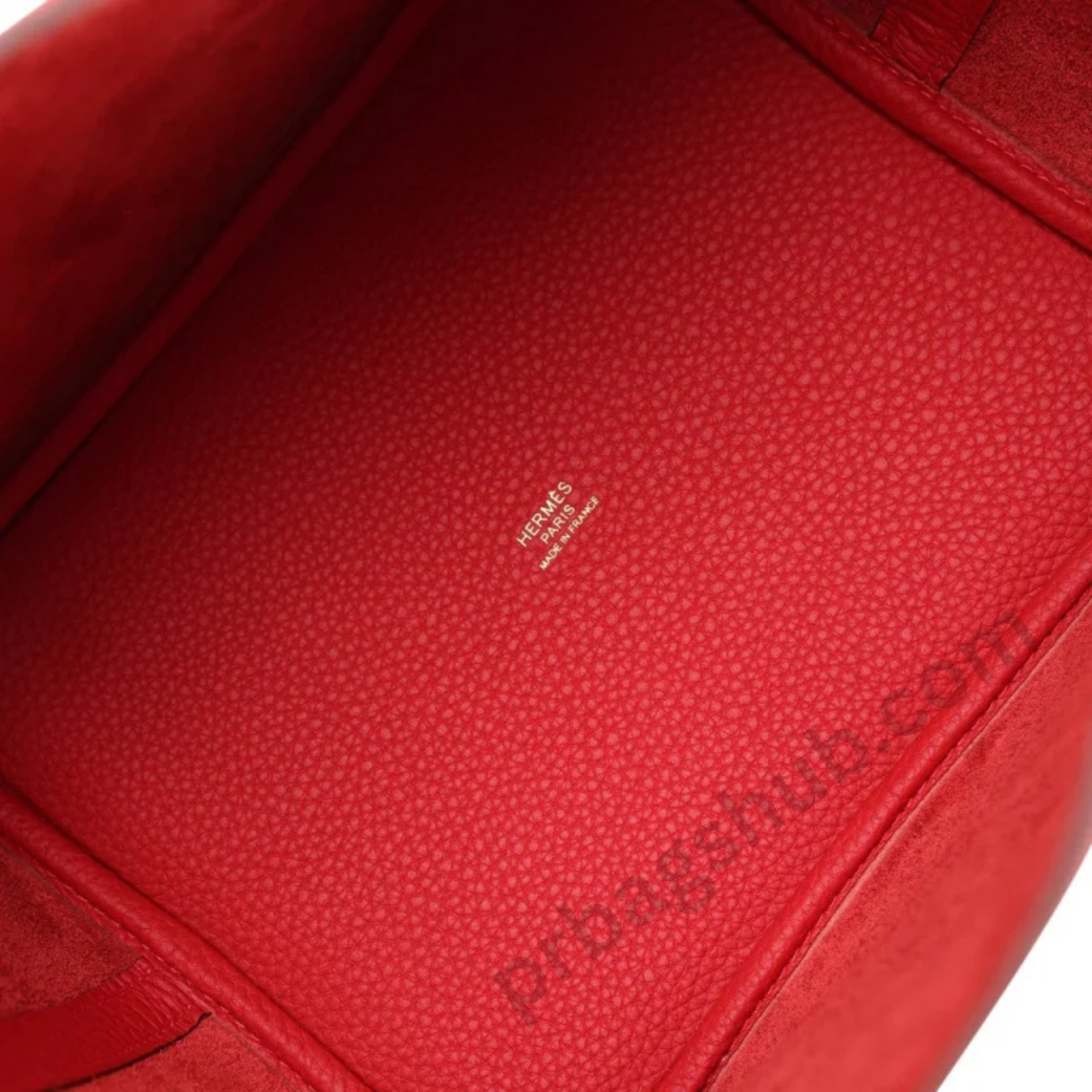 red-picotin-style-bucket-bag-interior-base-with-grain-leather-texture-and-logo-detail