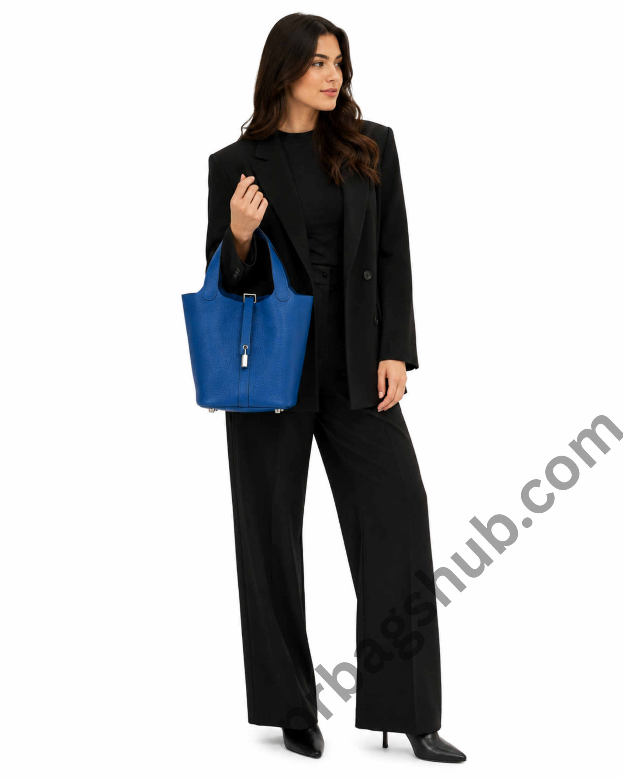 blue-picotin-style-bucket-bag-held-by-woman-in-black-outfit-on-white-background